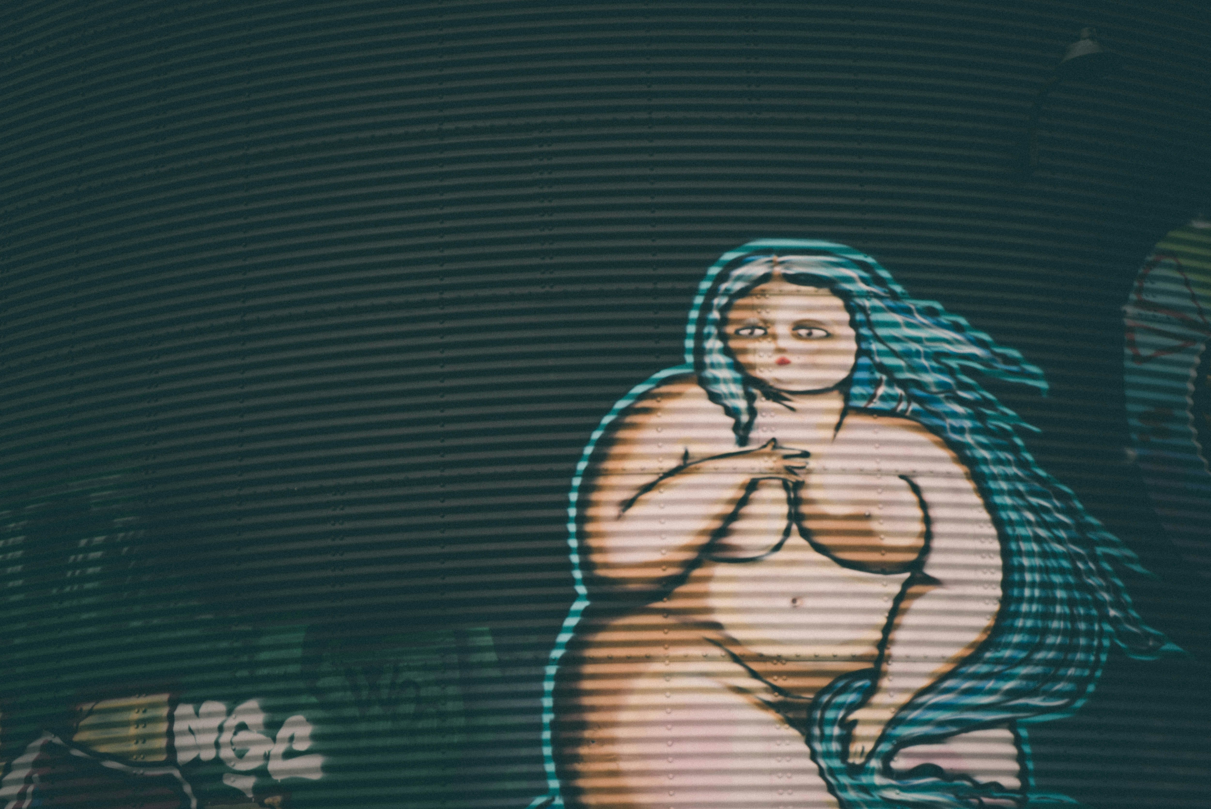 A naked animated BBW painted on a wall.